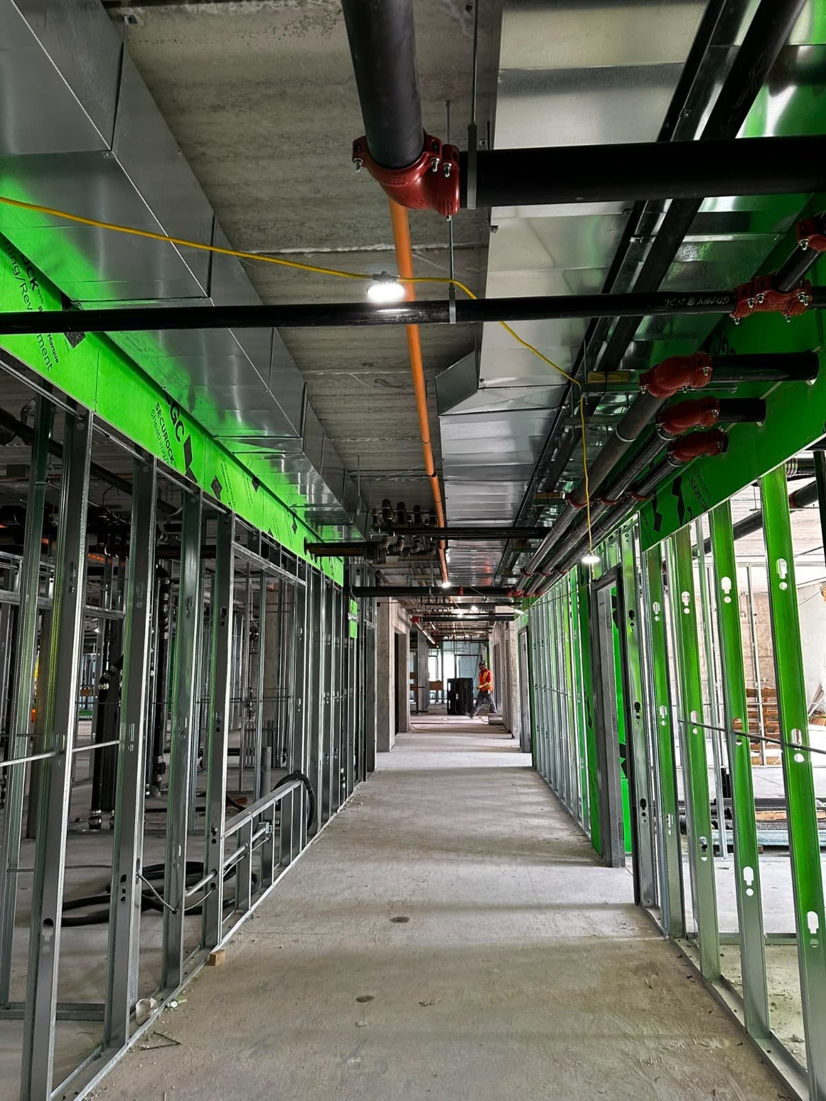 HVAC ductwork running through a commercial corridor
